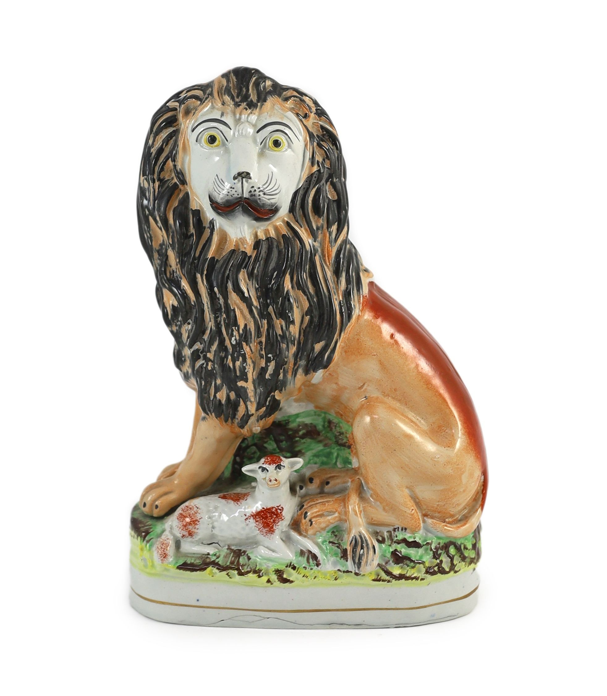 A Staffordshire ‘lion and lamb’ group, mid 19th century, Height 26cm.